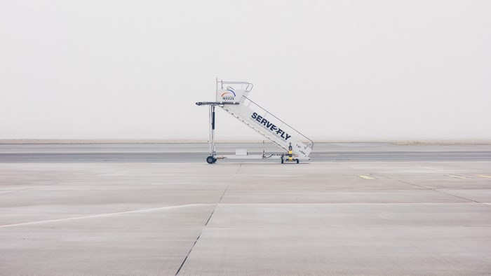 Serve-Fly airstair at Weeze Airport on a foggy day