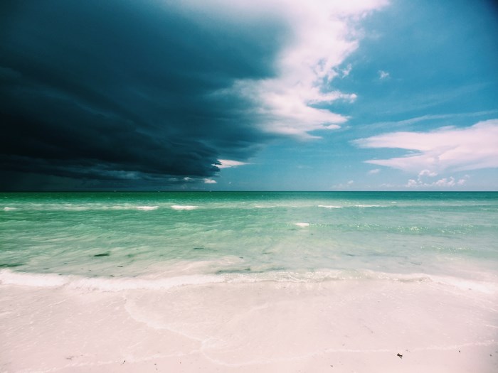 Stormy sky over a tropical beach and ocean
