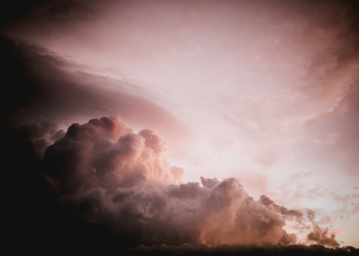 Dramatic storm clouds with pink and purple hues