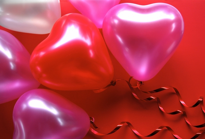 Heart-shaped balloons with ribbons