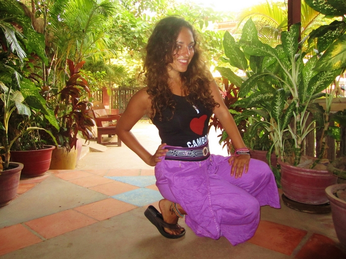 Woman in purple pants and black tank top