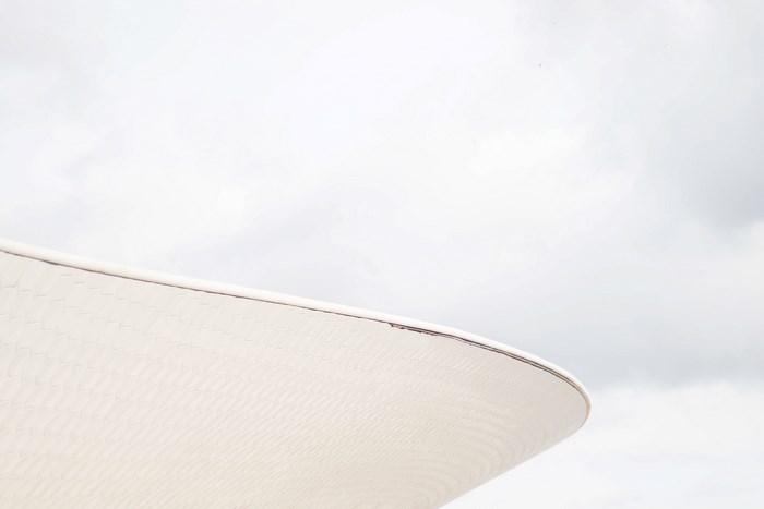 Minimalist White Curved Roof in Lisbon Sky