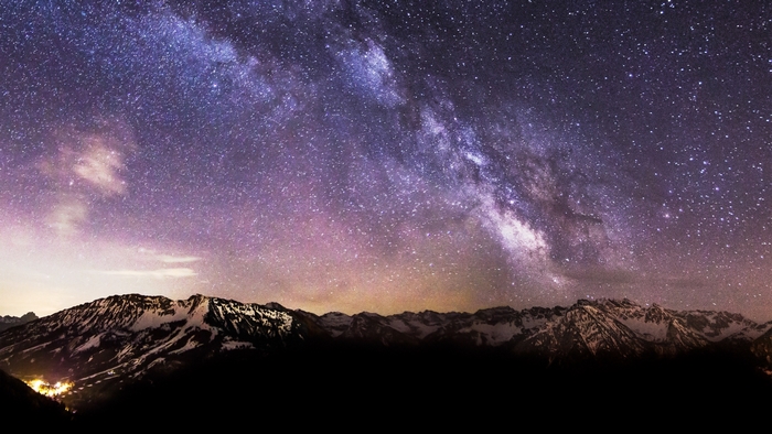 Milky Way over snow-capped mountains