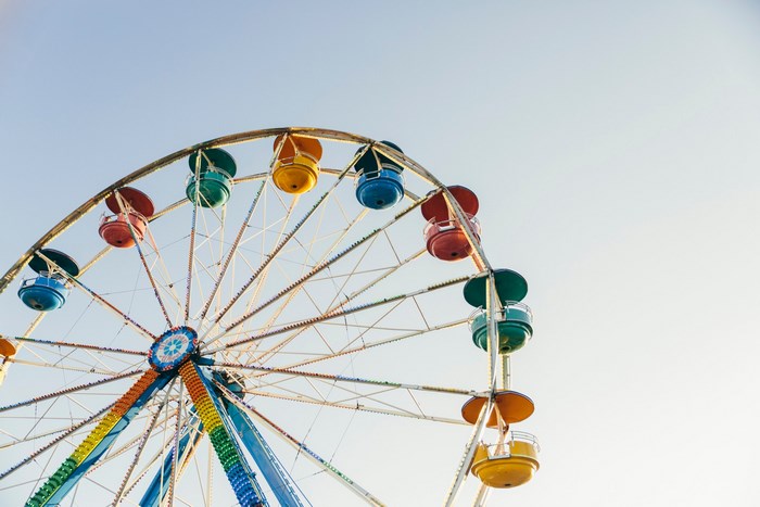 Colorful Ferris Wheel against a Clear Sky