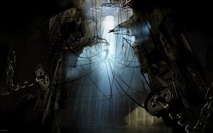 A dark industrial cavern with a central light source