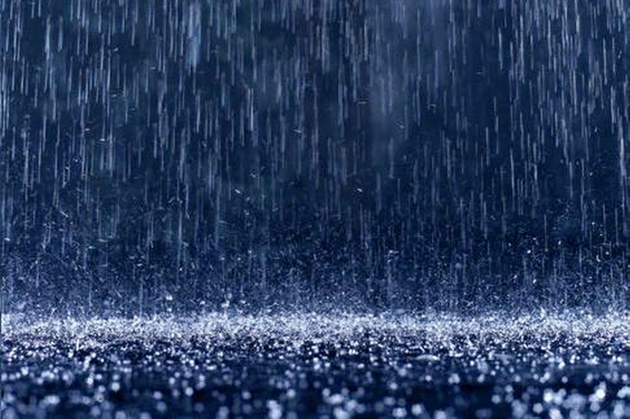Rain falling on a dark surface