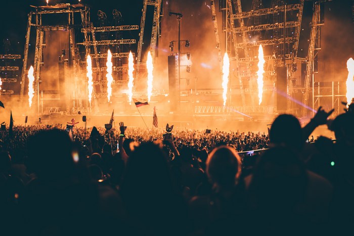 EDC Las Vegas crowd with flames and stage lights