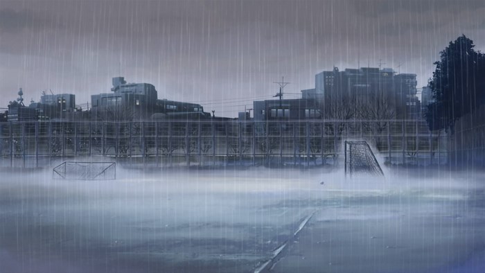 Rainy schoolyard with soccer goals