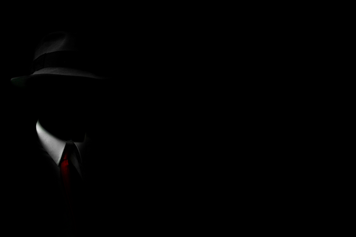 Man in Hat and Suit with Red Tie