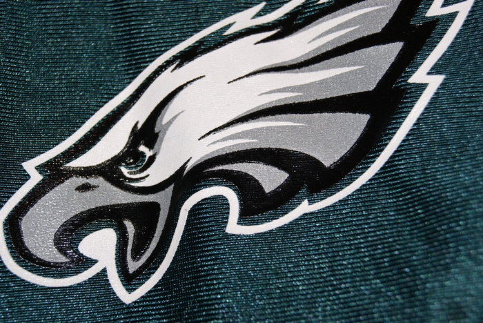 Philadelphia Eagles logo on green fabric