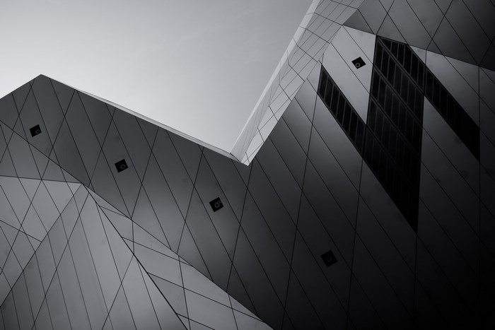 Abstract geometric architecture against a clear sky
