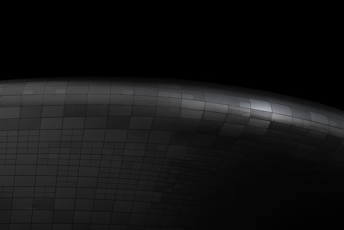 Dark Minimalist Metal Surface with Grid Texture