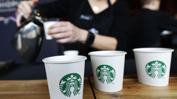 Starbucks coffee cups being filled