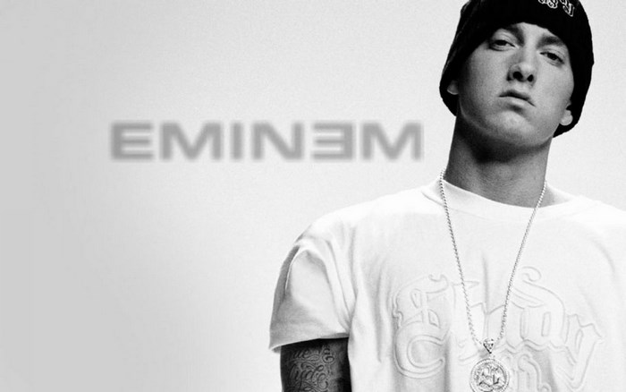 Eminem wearing a beanie and necklace