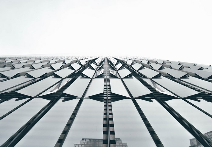 Abstract geometric skyscraper facade with reflections
