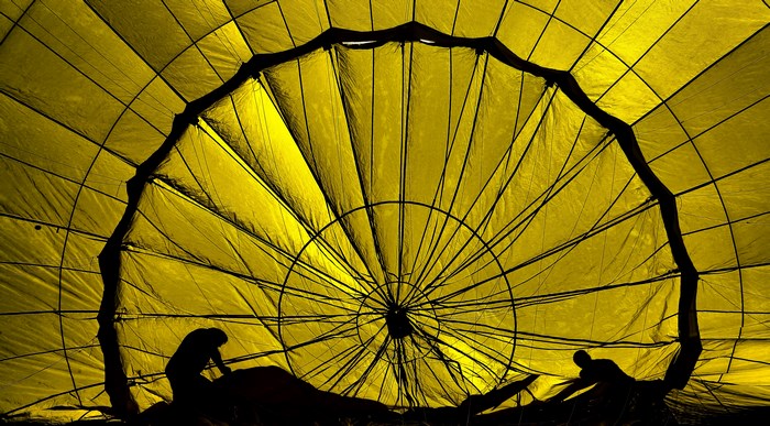 Inside a yellow hot air balloon with people