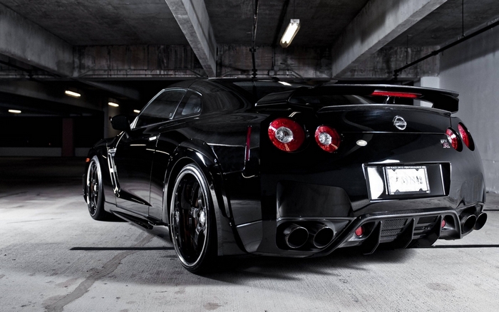 Black Nissan GT-R parked in a garage