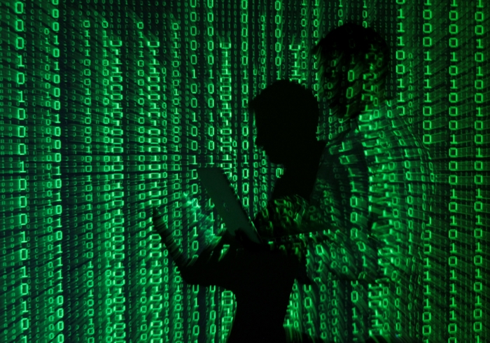 Silhouettes against a digital matrix