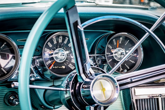 Classic turquoise Ford Thunderbird dashboard and steering wheel