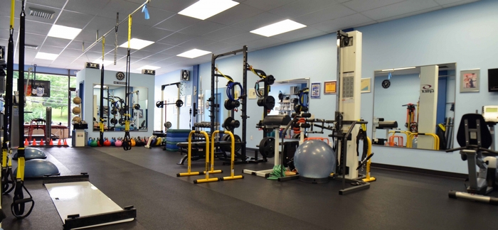 Gym with exercise equipment and weights