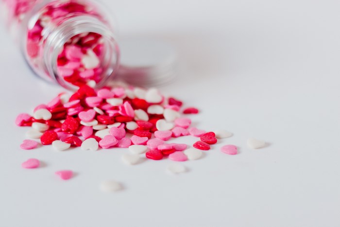 Colorful Heart-Shaped Candy Sprinkles in Jar