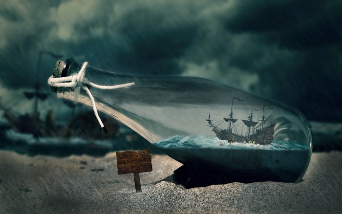 Ship in a bottle on a beach