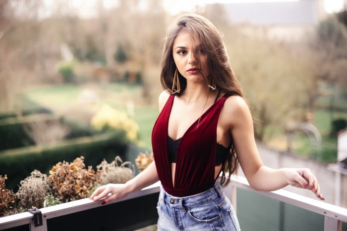Woman posing on a balcony