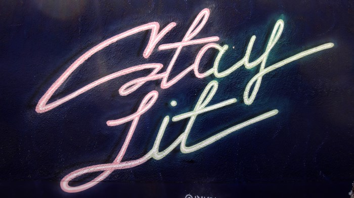 Graffiti mural with "stay lit" text
