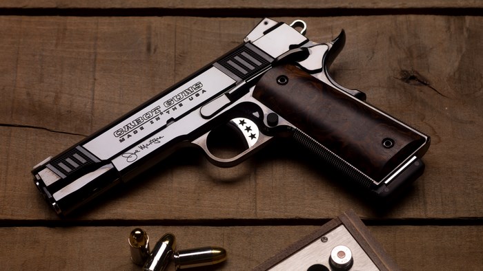 Steel and Wood Cabot Pistol on Wooden Surface