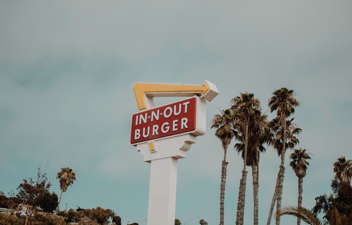 In-N-Out Burger sign with palm trees