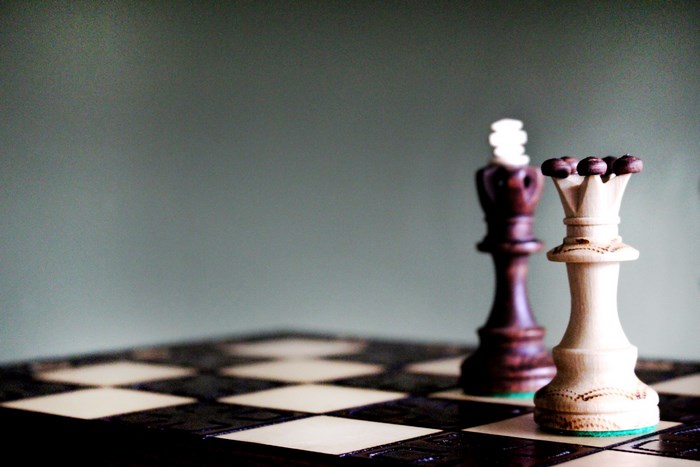 Chess king and queen on a chessboard