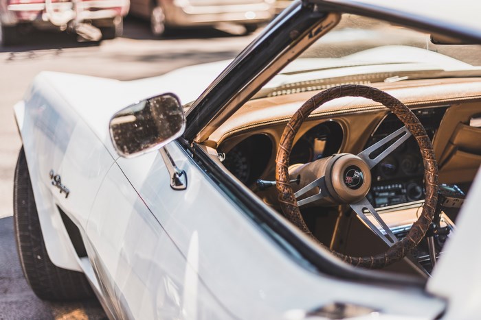 White Corvette Stingray interior with steering wheel