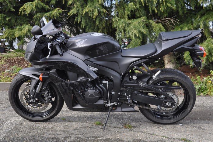 Black Honda CBR600RR motorcycle parked outdoors
