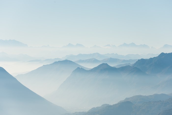 Misty Layers of the Italian Alps at Dawn