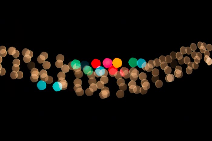 Bokeh of colorful Christmas lights on black background