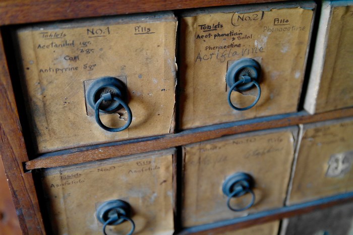 Vintage Apothecary Drawers with Labeled Pills
