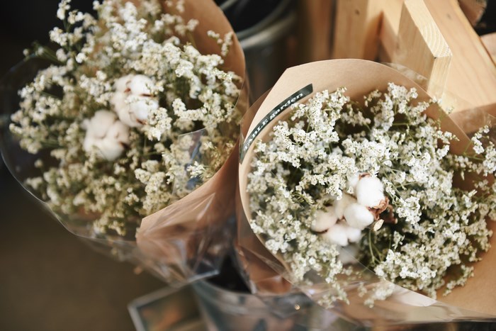 Two bouquets of white flowers with cotton