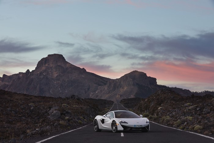 White McLaren 570S on a mountain road