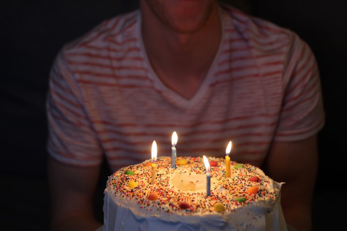 Birthday cake with candles and sprinkles