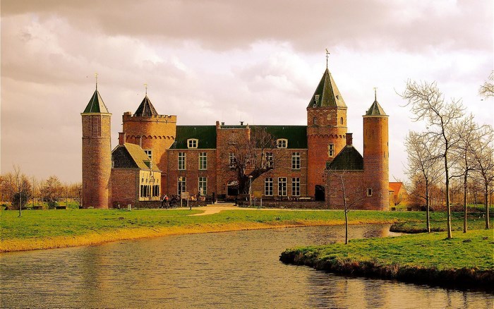 Westhove Castle with moat and trees