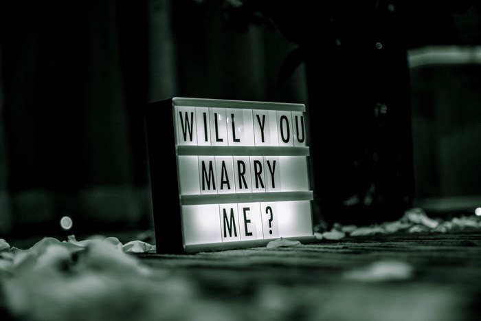 Lightbox sign asking "Will You Marry Me?"