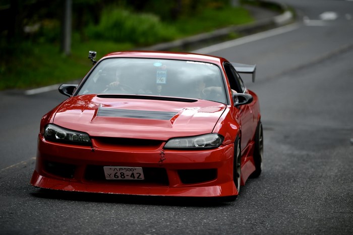 Red Nissan Silvia S15 on a Road