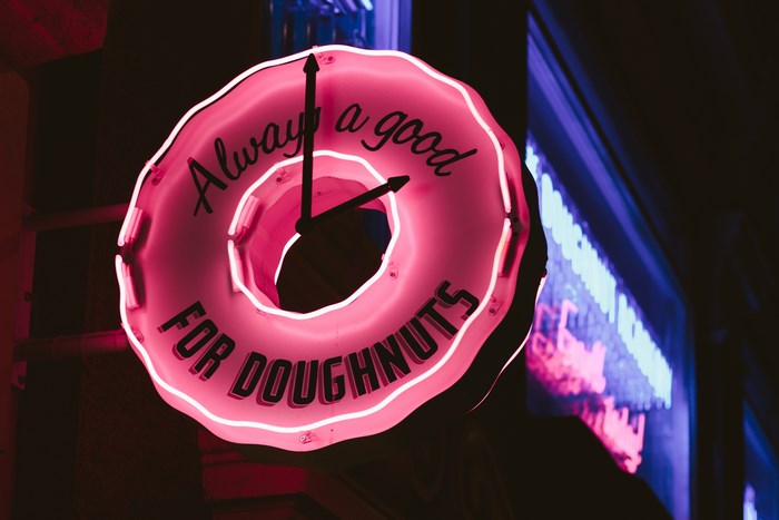 Pink Neon Doughnut Shop Clock Sign in London