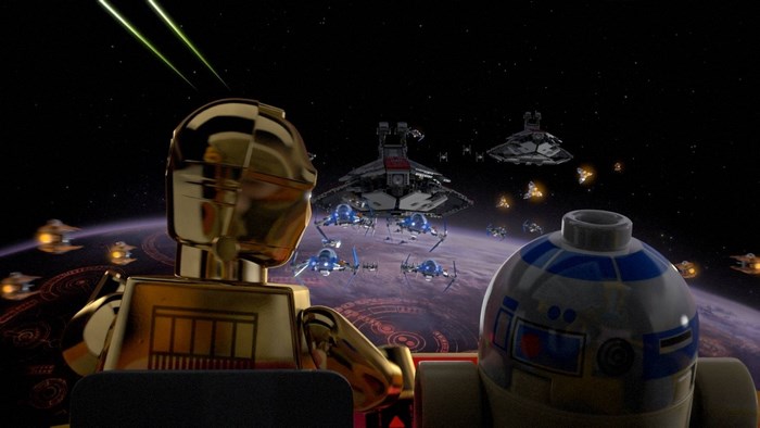 C-3PO and R2-D2 watch a Lego Star Wars space battle