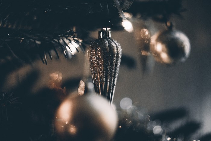 Christmas tree with glittery ornament and bokeh lights