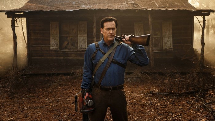 Ash Williams from Evil Dead with chainsaw and shotgun