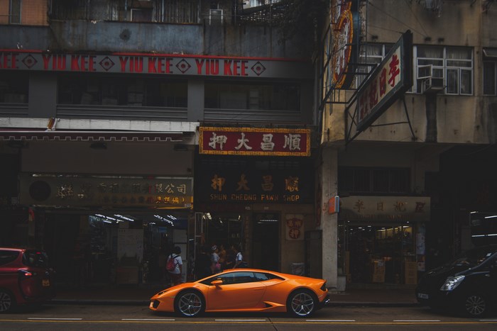 Orange Lamborghini parked in front of Shun Cheong Fawn Shop
