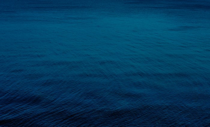 Deep Blue Open Sea with Gentle Ripples