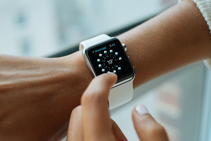 Person checking Apple Watch weather in Montreal