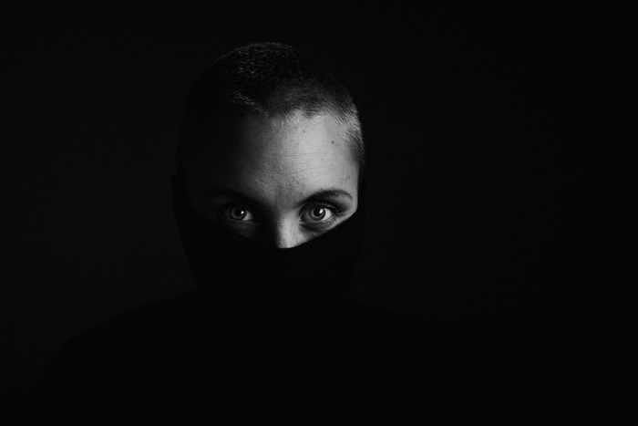 Woman with short hair wearing a turtleneck